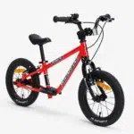 Red Kidvelo Rookie 14 convertible balance bike in balance-bike mode, shown from the front three-quarter view for Xchange Sports Australia.