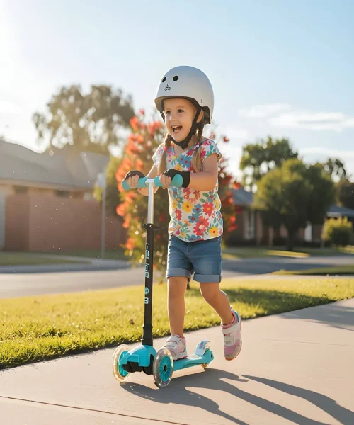I Glide 3 Wheel Kids Scooter - Aqua - Lifestyle Girl riding scooter on sidewalk